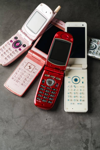 istock Old used cell phone on dark background 1459958450