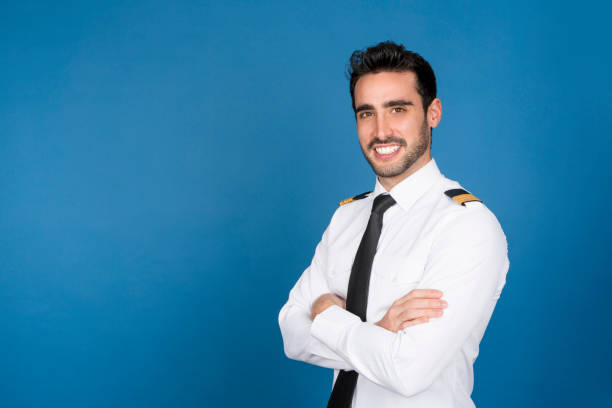 istock Airplane pilot smiling at camera with his arms crossed 1459958459