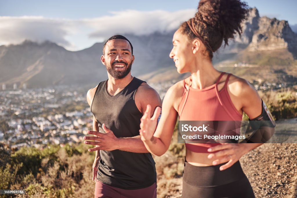 Training, exercise and black couple running in nature for fitness, heart health and wellness. Sports, cardio and happy man and woman jog or runner workout outdoors preparing for marathon together. Running Stock Photo