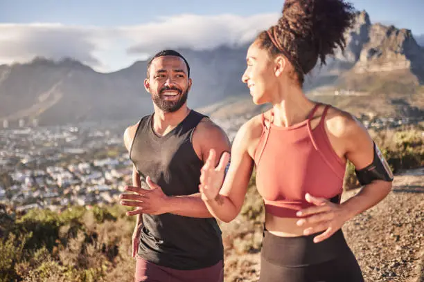 Photo of Training, exercise and black couple running in nature for fitness, heart health and wellness. Sports, cardio and happy man and woman jog or runner workout outdoors preparing for marathon together.