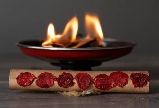 Scroll with seven seals in front of a burning fire flames stock photo