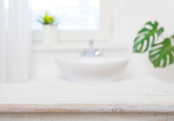 istock Bathroom table top for product display on blurred sink background 1459963864