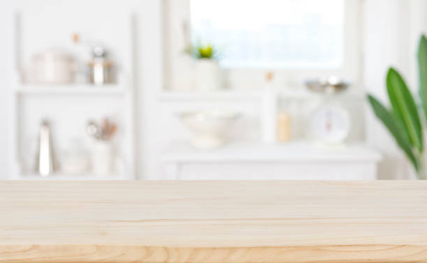 istock Blur kitchen counter background with wooden table for product display 1459963868