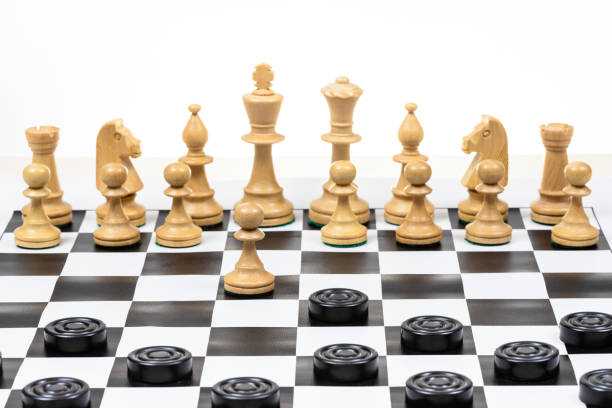 istock chess pawn and checkers piece move 1459966598
