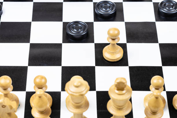 istock above view of pawn and checkers piece move closeup 1459966604