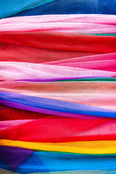 istock Close focus on colorful synthetic fabric clothes. 1459966622