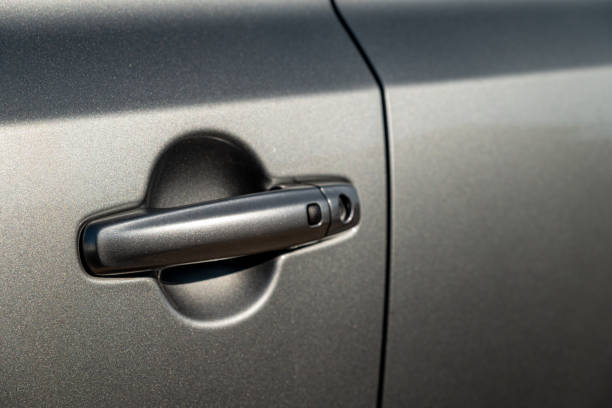 istock Car door handle with unlock button. keyless entry car door handle with touch sensor 1459966624