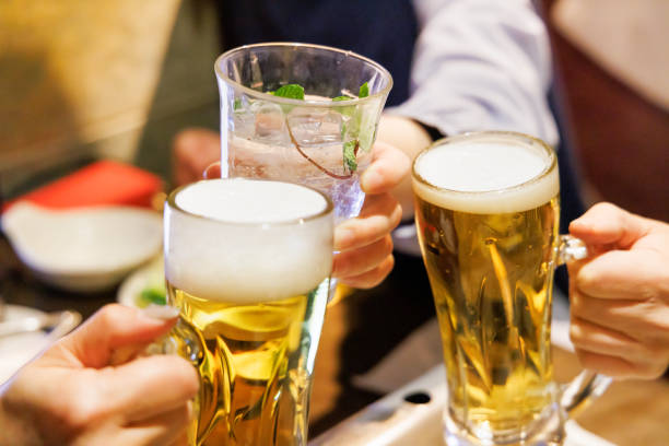 istock People toasting with beer and sour at a restaurant 1459967456