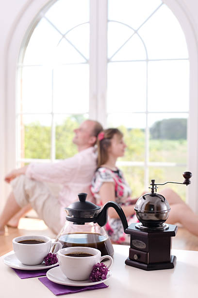 Couple in love at home / focus on the morning coffee stock photo
