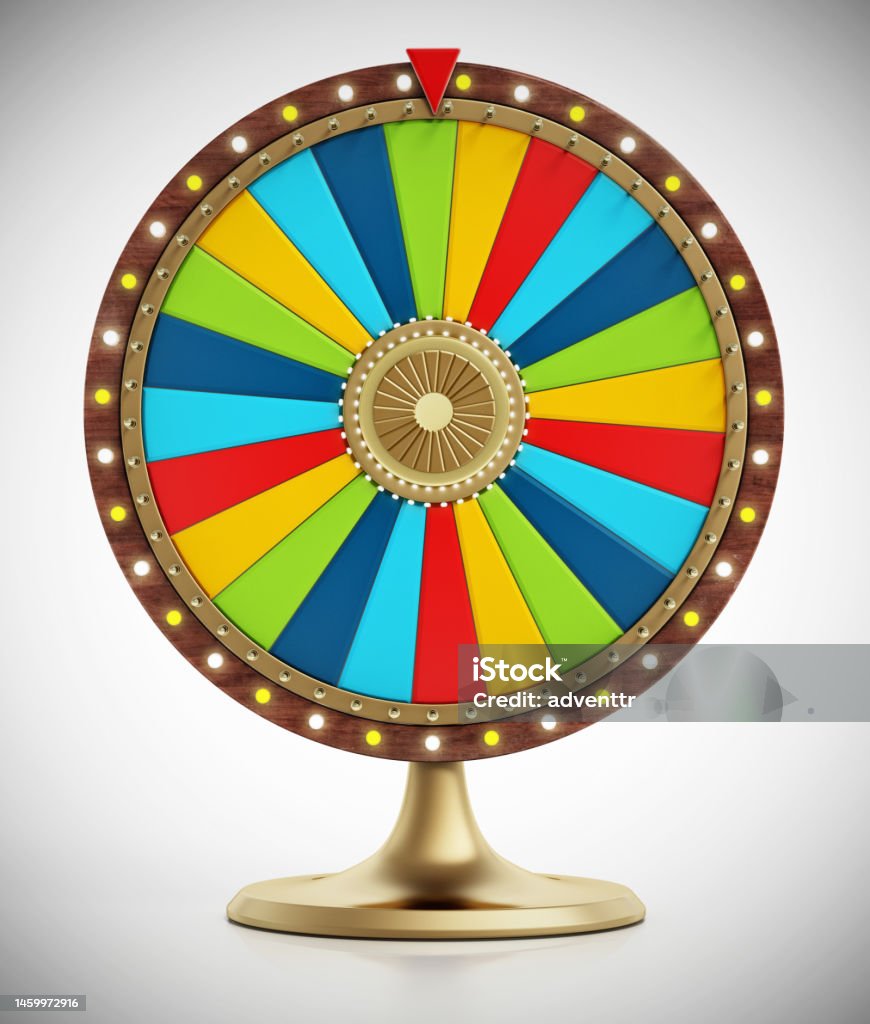 Multi-colored prize wheel on gray, vignette background Multi-colored prize wheel on gray, vignette background. Wheel Stock Photo