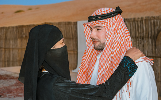 Couple Arabic clothes during Dubai desert safari at the safari camp, Dubai United Arab Emirates