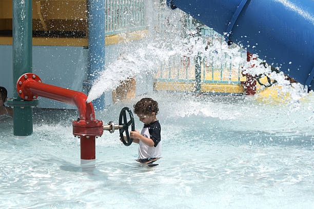 Boy Playing at WaterPark stock photo