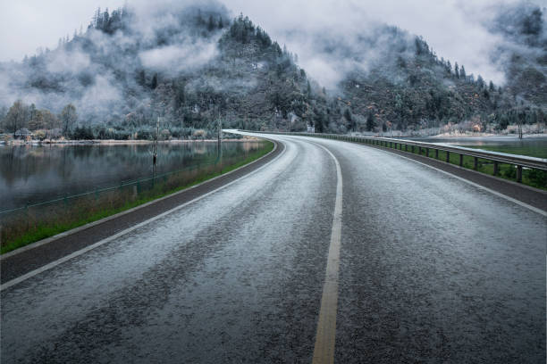 istock Mountain road, fog 1459975702
