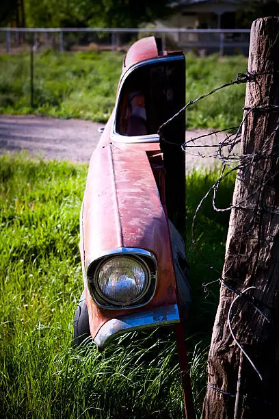 Old car cut for side display only as yard art.