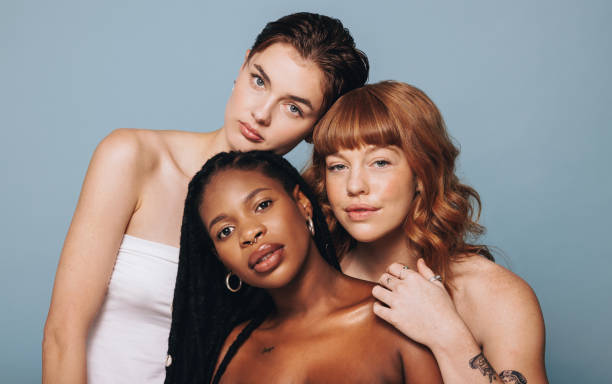 istock Women with different skin tones standing together 1459977644