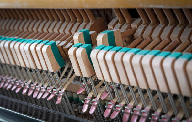 istock Details of piano mechanism gavel - string, pins and hammers 1459979572