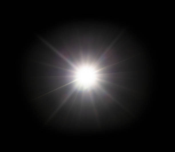 White light sun flare effect on black background stock photo