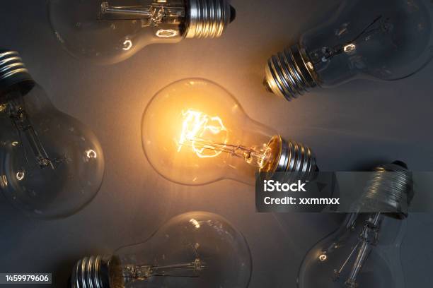 Idea Concept With Classic Light Bulb Glowing Stock Photo - Download Image Now - Discovery, Electricity, Bright