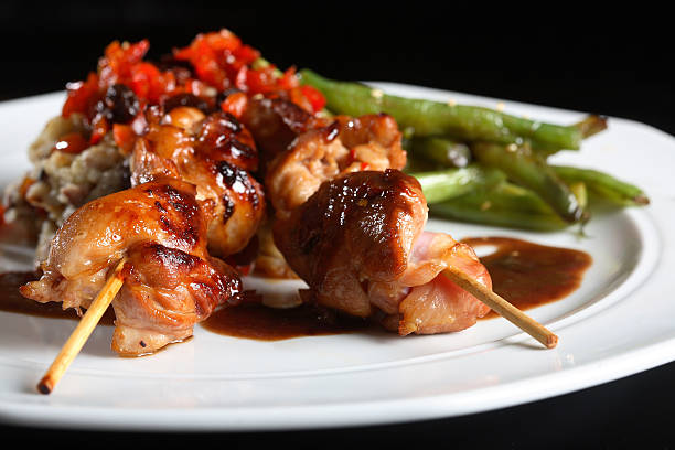 chicken satay on skewers stock photo