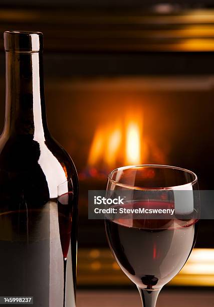 Fireplace Red Wine Stock Photo - Download Image Now - Fireplace, Wine Bottle, Alcohol - Drink