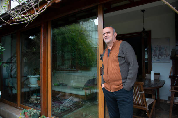 istock A man in front of his house 1459982775