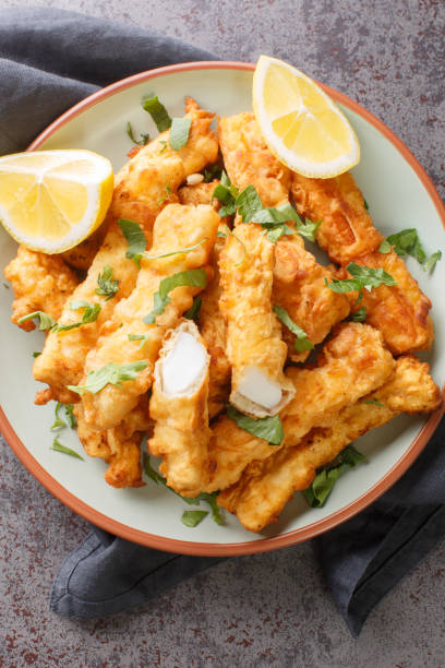 istock Fried Spanish Squid Rabas Fritas closeup on the plate. Vertical top view 1459985561