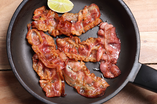 Greasy fried bacon
