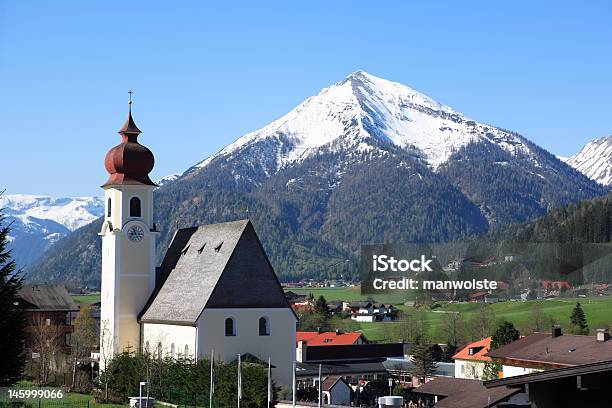 Traditional Austrian Church In Tirol With Snowcovered Mountain Stock Photo - Download Image Now