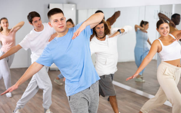 istock Group of women and men training sport dance in modern studio 1459990834