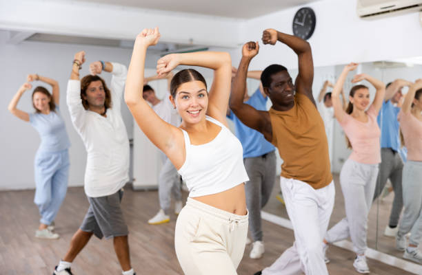 istock Group of different people rehearsing dance in dance studio 1459990921