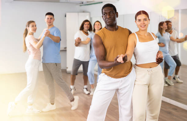 istock Group of different people rehearsing dance in dance studio 1459990949