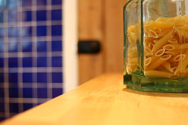 Jar of pasta in the kitchen stock photo