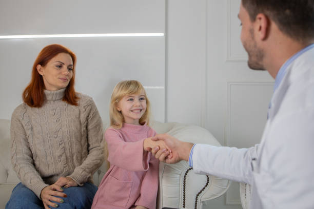 istock Mother with her daughter at the dentist office 1459992667