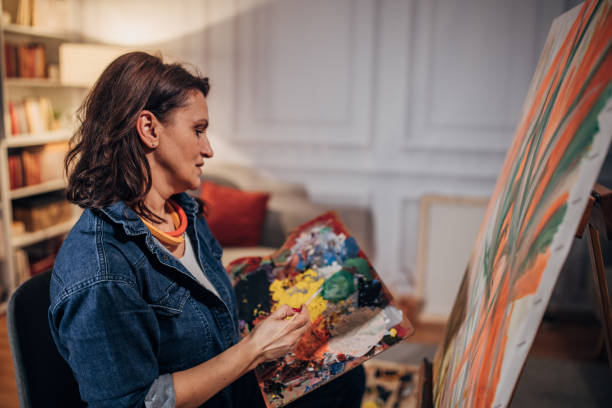 istock Mature woman painting 1459992893