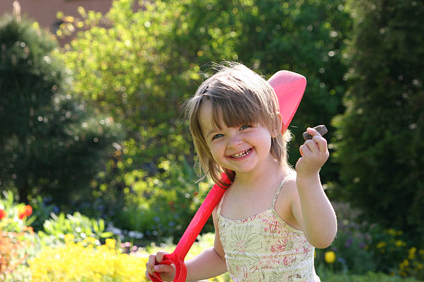 Smll Girl with the shovel stock photo