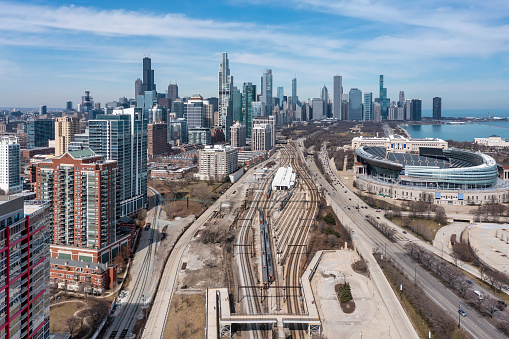 Aerial view of downtown Chicago from south of the loop with Soldier Field, the skyline and Monroe Harbor in the distance.