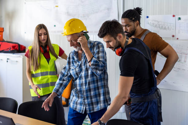 istock Young Construction Workers and Their Senior Colleague are Analyzing Construction Plans in the Office. 1459995888
