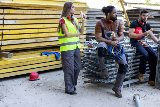 istock Multicultural Group of Building Workers are Taking a Rest and Refreshing with Food and Drink. 1459995908