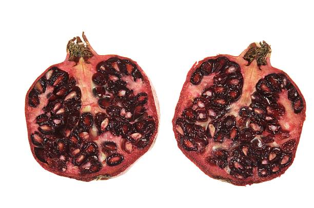 two slices of pomegranate stock photo