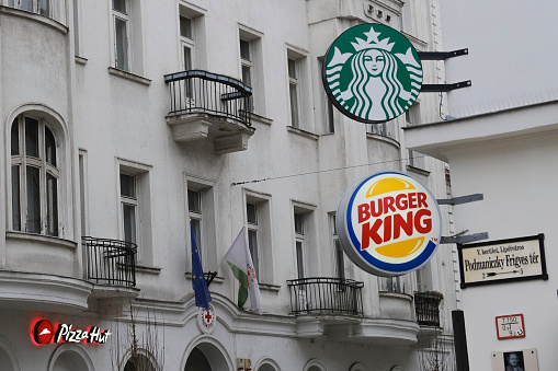 Exterior view of Burger King and Starbucks branch in  Budapest , Hungary on December 22, 2022.