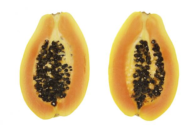 two pieces  of papaya fruit stock photo