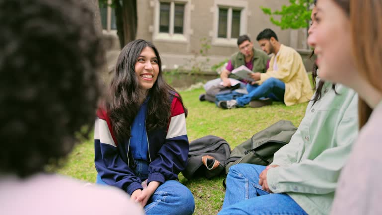 Women relaxing outdoors between university classes