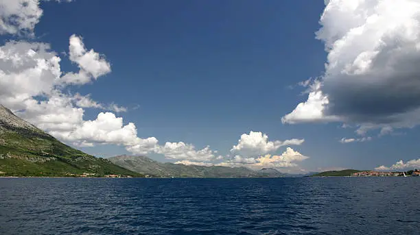 Landscape from Crotia. Mediterian sea and blue sky with white clouds.