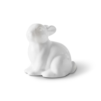 Easter white porcelain bunny isolated on white background. Close up.