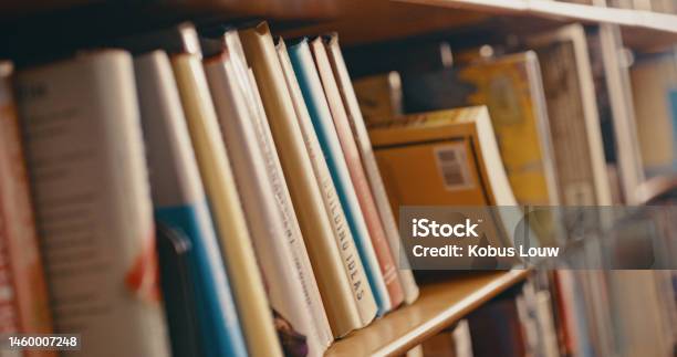 Library Research And Row Of Books On Bookshelf For Reading Knowledge And Educational Learning University Bookstore Information And Zoom Of Shelves With Textbook Academic Journal Or Literature Stock Photo - Download Image Now