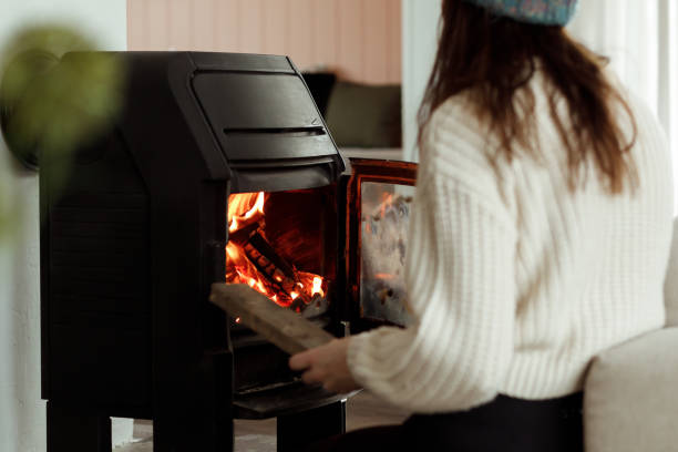 istock Putting wood in the fireplace 1460009635