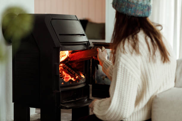 istock Putting wood in the fireplace 1460009638