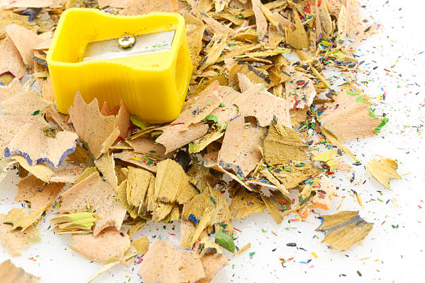 istock Yellow pencils sharpener on a pile of shavings, isolated 146001132