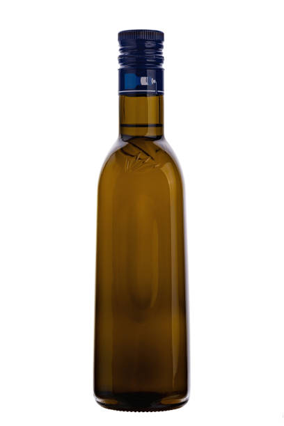 istock Olive oil bottle in closeup isolated on white background. 1460011447