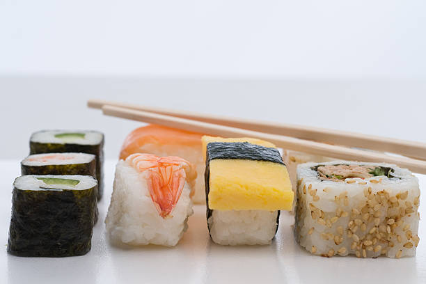 Sushi with chopsticks stock photo